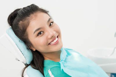 patient about to get her teeth cleaned at Smile Design Center